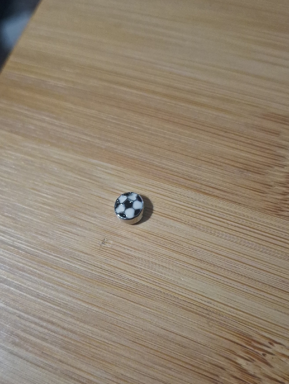 Soccer Button Accent on Purple Fabric